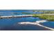 Aerial view of a coastal highway bridge and waterway with lush greenery at 703 32Nd Street E Ct, Bradenton, FL 34208