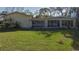 Large backyard with house and green lawn at 703 32Nd Street E Ct, Bradenton, FL 34208