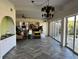 Dining room with herringbone tile floor and sliding doors to patio at 703 32Nd Street E Ct, Bradenton, FL 34208