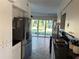 Kitchen with stainless steel appliances and view to backyard at 703 32Nd Street E Ct, Bradenton, FL 34208