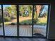 View of a relaxing patio with access to a lush green backyard at 703 32Nd Street E Ct, Bradenton, FL 34208