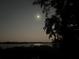 Peaceful waterfront view at night, showcasing a tranquil moonlit scene at 703 32Nd Street E Ct, Bradenton, FL 34208