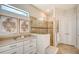 Bathroom with walk-in shower, tiled walls, and modern vanity at 7125 Gradford Ct, Lakewood Ranch, FL 34202