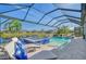 Resort-style pool and spa with covered patio and lush landscaping at 7125 Gradford Ct, Lakewood Ranch, FL 34202