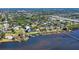 Aerial view of waterfront community with lush landscaping and numerous houses at 7800 18Th W Ave, Bradenton, FL 34209