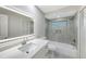 Updated bathroom with a tub, quartz countertop and vanity at 7800 18Th W Ave, Bradenton, FL 34209