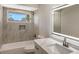 Modern bathroom with a tub, quartz countertop, and LED mirror at 7800 18Th W Ave, Bradenton, FL 34209