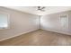 Well-lit bedroom featuring hardwood flooring and two windows at 7800 18Th W Ave, Bradenton, FL 34209