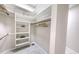 Spacious walk-in closet with built-in shelves and hanging rods at 7800 18Th W Ave, Bradenton, FL 34209