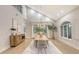 Bright dining room with hardwood floors, large windows, and a stylish wooden table at 7800 18Th W Ave, Bradenton, FL 34209