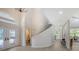 Bright and airy foyer with curved staircase and hardwood floors at 7800 18Th W Ave, Bradenton, FL 34209