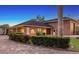 Brick garage with a paver driveway and landscaping at 7800 18Th W Ave, Bradenton, FL 34209
