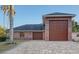 Detached three-car brick garage with large door at 7800 18Th W Ave, Bradenton, FL 34209