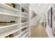 Elegant hallway with built-in shelving and access to a staircase at 7800 18Th W Ave, Bradenton, FL 34209