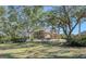Two story house with mature trees at 7800 18Th W Ave, Bradenton, FL 34209