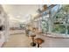 Modern kitchen with white cabinets, granite countertops, and a breakfast bar at 7800 18Th W Ave, Bradenton, FL 34209