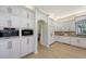 Spacious kitchen with white cabinets, granite countertops, and stainless steel appliances at 7800 18Th W Ave, Bradenton, FL 34209
