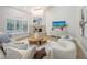 Relaxing living room with a fireplace and views of the backyard pool at 7800 18Th W Ave, Bradenton, FL 34209