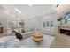 Spacious living room featuring a cozy fireplace and ample natural light at 7800 18Th W Ave, Bradenton, FL 34209