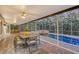 Enclosed patio with dining area and view of the pool at 7800 18Th W Ave, Bradenton, FL 34209