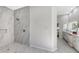 Large walk-in shower with marble tile and pebble floor at 7800 18Th W Ave, Bradenton, FL 34209