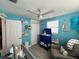 Bedroom with crib, dresser, and beach theme decor at 7954 43Rd N Ave, St Petersburg, FL 33709