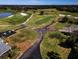Aerial view of golf course with various holes and landscape at 8532 Eagle Preserve Way, Sarasota, FL 34241