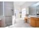 Bright bathroom with a walk-in shower, soaking tub, and double vanity at 8532 Eagle Preserve Way, Sarasota, FL 34241