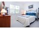 Spacious bedroom with a queen-size bed and plenty of natural light at 8532 Eagle Preserve Way, Sarasota, FL 34241