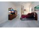 Comfortable main bedroom with a dresser and access to the bathroom at 8532 Eagle Preserve Way, Sarasota, FL 34241