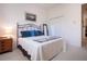 Guest bedroom with a queen-size bed and spacious closet at 8532 Eagle Preserve Way, Sarasota, FL 34241