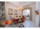 Formal dining room with a large table, chandelier, and classic decor at 8532 Eagle Preserve Way, Sarasota, FL 34241