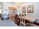 Elegant dining room with a large table, hutch, and decorative accents at 8532 Eagle Preserve Way, Sarasota, FL 34241