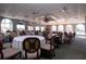 Elegant dining room with tables, chairs, and large windows at 8532 Eagle Preserve Way, Sarasota, FL 34241