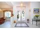 Elegant entryway featuring double doors, a tile floor, and decorative wreaths at 8532 Eagle Preserve Way, Sarasota, FL 34241