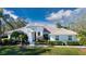 Beautiful one-story home with tile roof, lush landscaping, and a large driveway at 8532 Eagle Preserve Way, Sarasota, FL 34241