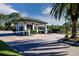 Gated entrance to community with guard house and landscaping at 8532 Eagle Preserve Way, Sarasota, FL 34241