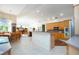 Open kitchen with light wood cabinets and a breakfast nook at 8532 Eagle Preserve Way, Sarasota, FL 34241