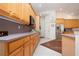 Well-equipped kitchen boasting wood cabinets and granite countertops at 8532 Eagle Preserve Way, Sarasota, FL 34241