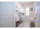 Convenient laundry room with washer, dryer, and cabinets at 8532 Eagle Preserve Way, Sarasota, FL 34241