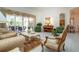 Spacious living room with ample natural light and comfortable furnishings at 8532 Eagle Preserve Way, Sarasota, FL 34241