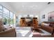 Bright living room with leather furniture and pool view at 8532 Eagle Preserve Way, Sarasota, FL 34241