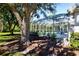 Private screened pool surrounded by mature trees at 8532 Eagle Preserve Way, Sarasota, FL 34241
