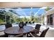 Relaxing screened-in pool area with patio furniture at 8532 Eagle Preserve Way, Sarasota, FL 34241