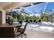 Inviting pool area with screened enclosure, lounge chairs, and a spa at 8532 Eagle Preserve Way, Sarasota, FL 34241