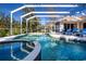 Enjoy this luxurious pool and spa with screened enclosure at 8532 Eagle Preserve Way, Sarasota, FL 34241