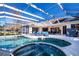 Relax by the pool and spa with a screened enclosure at 8532 Eagle Preserve Way, Sarasota, FL 34241
