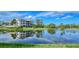 Building with scenic lake view and lush landscaping at 9620 Club South Cir # 5106, Sarasota, FL 34238