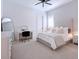 Spacious bedroom with a queen bed, a vanity, and plenty of natural light at 991 Seascape Pl, Sarasota, FL 34240