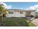 Single story home with carport and lush landscaping at 1040 Roberta St, Venice, FL 34285